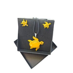 Rubylishious 
Silver set of earrings and pendant yellow amber turtle shape with